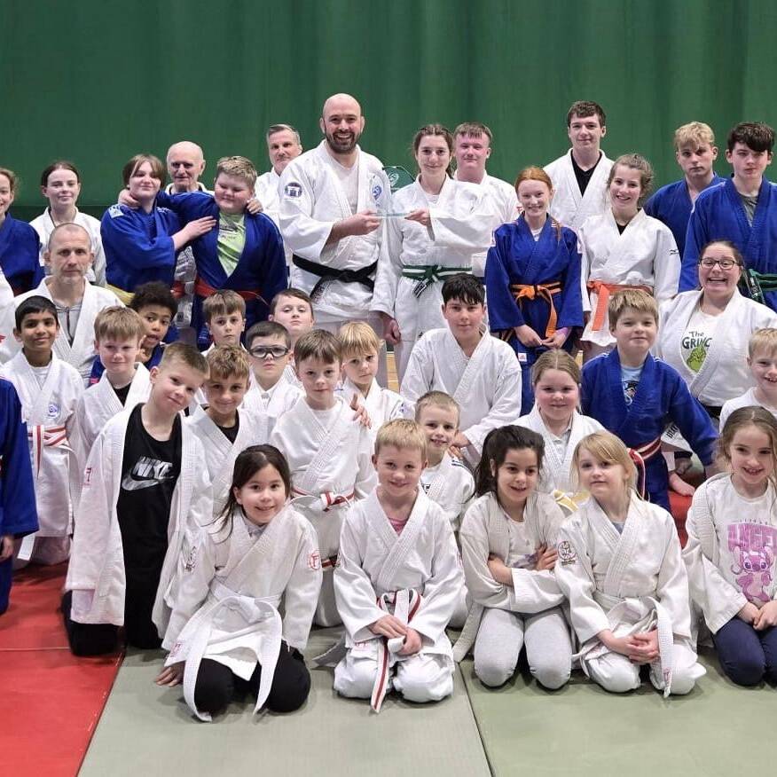 Leah receiving her award from San Ingram at her club.