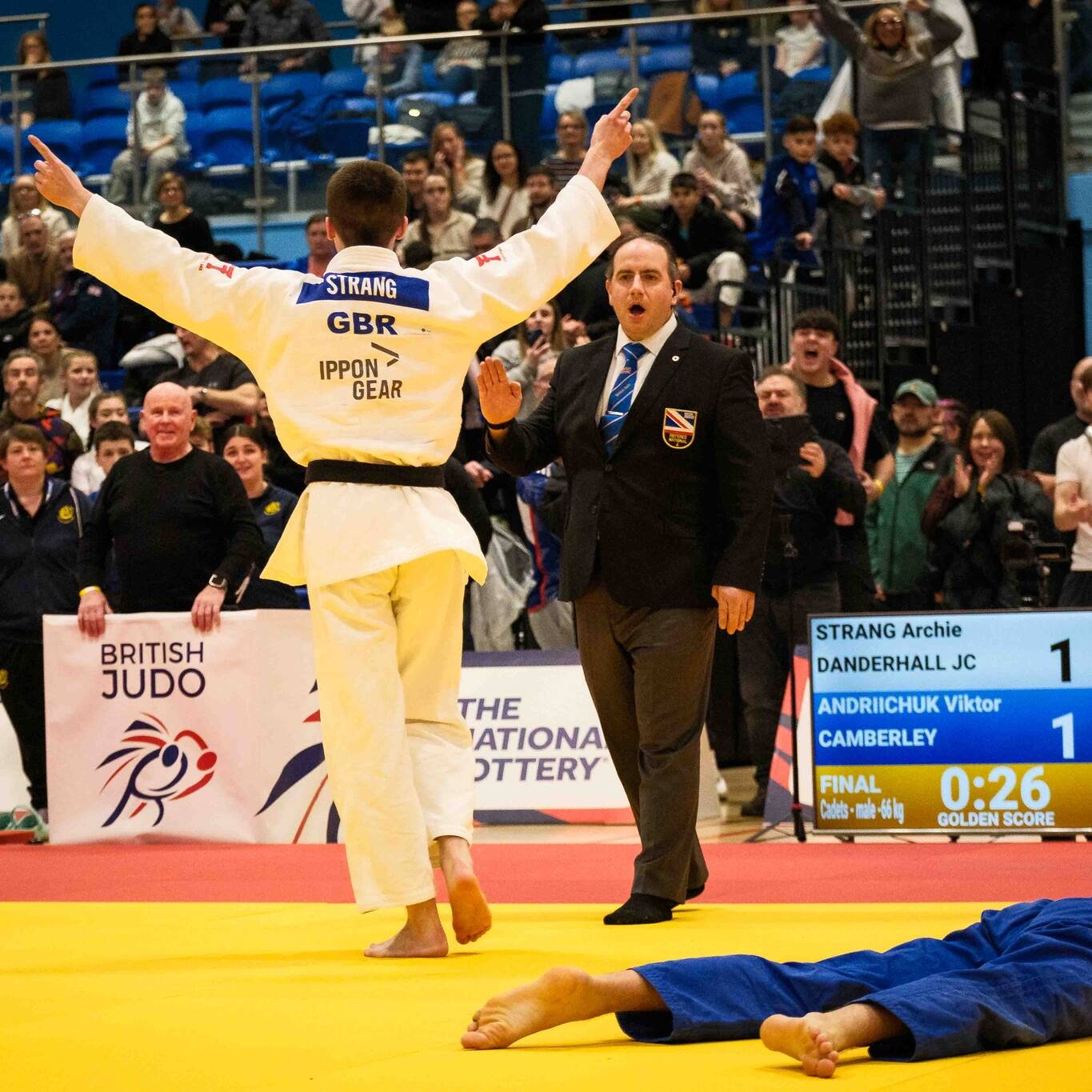 Finlay Strang celebrating a win at the British Champs as David Reilly watches on.
