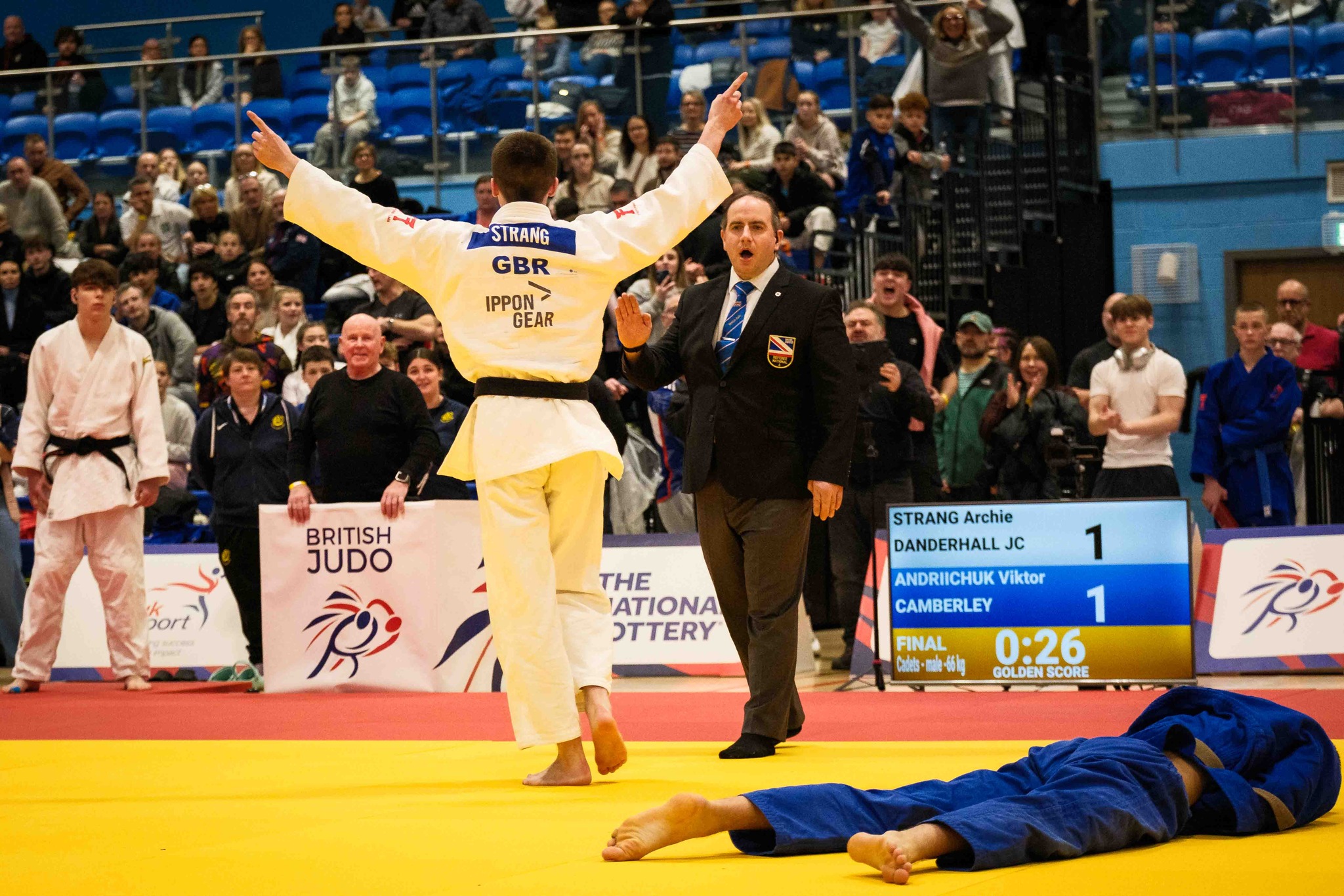 Finlay Strang celebrating a win at the British Champs as David Reilly watches on.